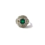 A diamond and emerald ballerina ring, set with a mixed square-cut emerald, within a ballerina