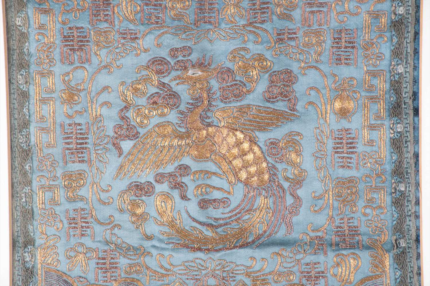 A framed 19th century Chinese silk panel with gilt braid, depicting a phoenix amongst geometric - Image 2 of 4