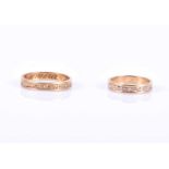 A pair of matching gold band rings, with textured decoration, interior of shanks engraved with names