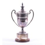 A George V silver trophy cup and cover, Sheffield 1934 by Mappin & Webb, with twin scrolled handles,