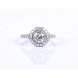 A diamond ring in the Art Deco style, centred with a round-cut diamond of approximately 0.80 carats,