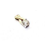 An 18ct yellow gold single stone diamond pendant, set with brilliant cut diamond in a white gold