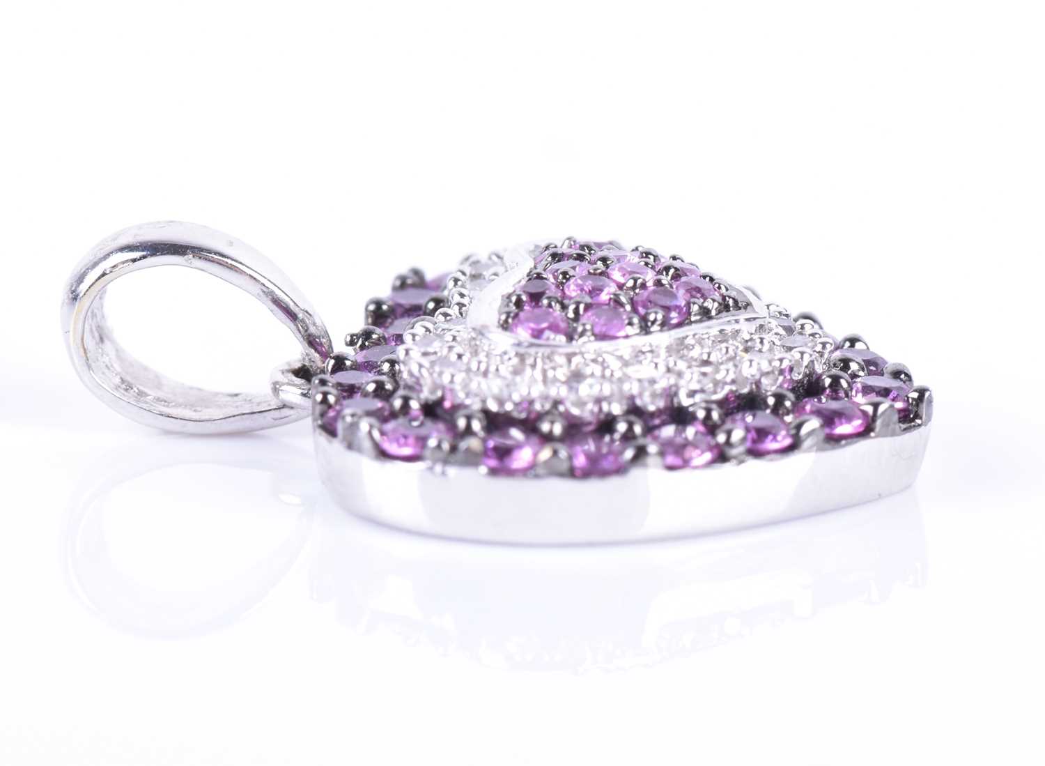 An 18ct white gold, diamond, and pink sapphire pendantof heart-shaped form, set with round-cut - Image 3 of 3