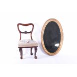 A child's Victorian mahogany chair and an oval gilt wall mirror, the chair with tapestry seat and