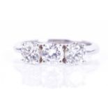 An 18ct white gold and diamond ringset with three round brilliant-cut diamonds of approximately 1.54