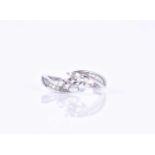 A 14ct white gold and diamond ringcentered with a round brilliant-cut diamond of approximately 0.