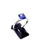 An 18ct white gold single stone tanzanite ring, the central claw set tanzanite weighing 1.75