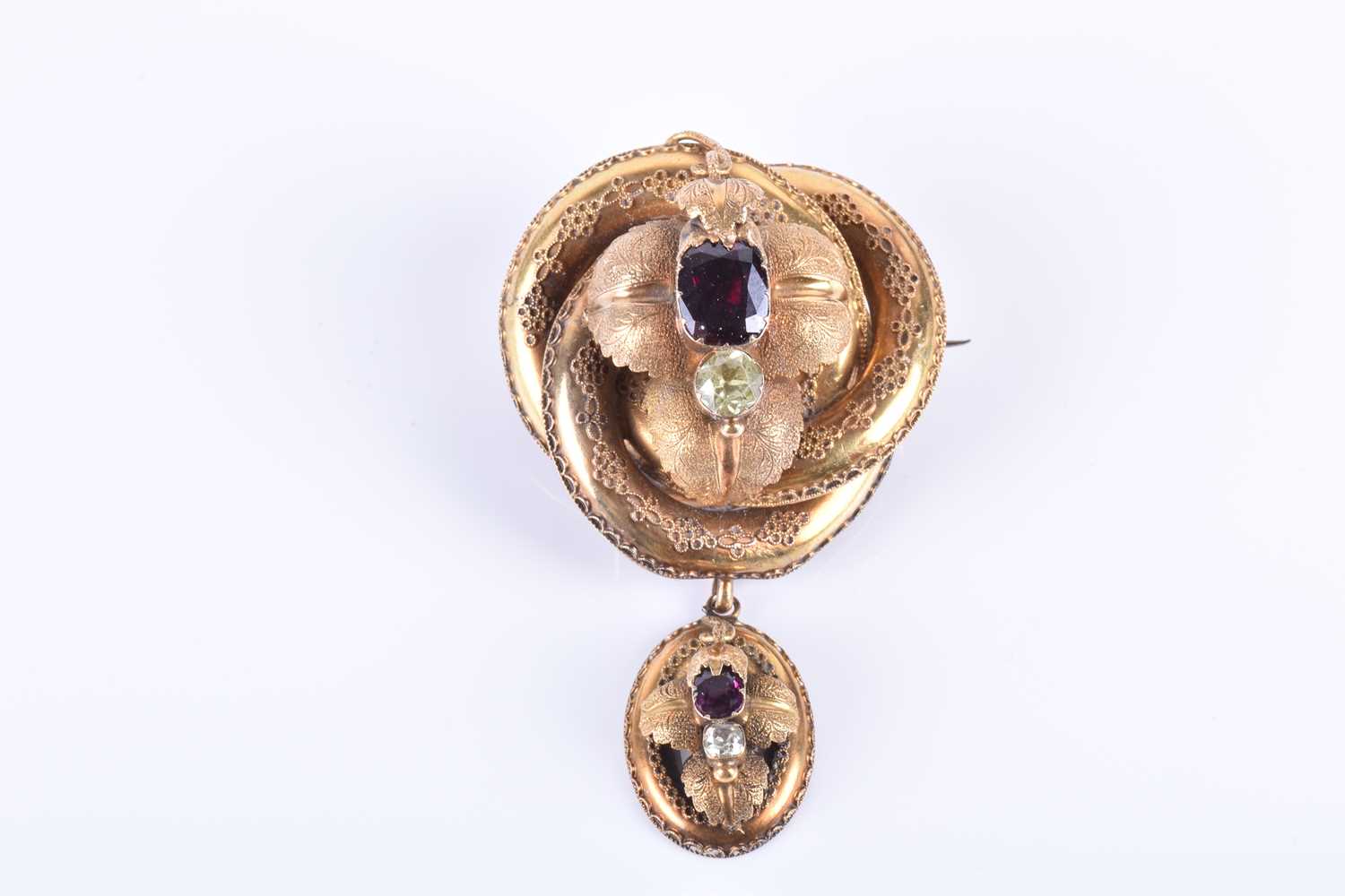 A Victorian yellow gold and garnet broochof knotted design, the mount with engraved decoration and - Image 2 of 6