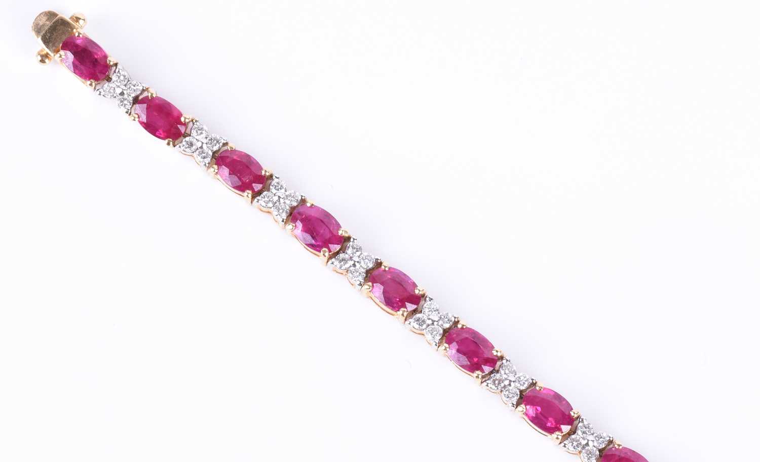 A fine 18ct yellow gold, diamond, and ruby line braceletset with nineteen mixed oval-cut rubies - Image 2 of 5
