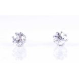 A pair of old round-cut solitaire diamond stud earringsthe diamonds of approximately 0.90 carats