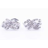 A pair of white metal and diamond cluster earrings, set with round and calibre-cut diamonds, 15 mm