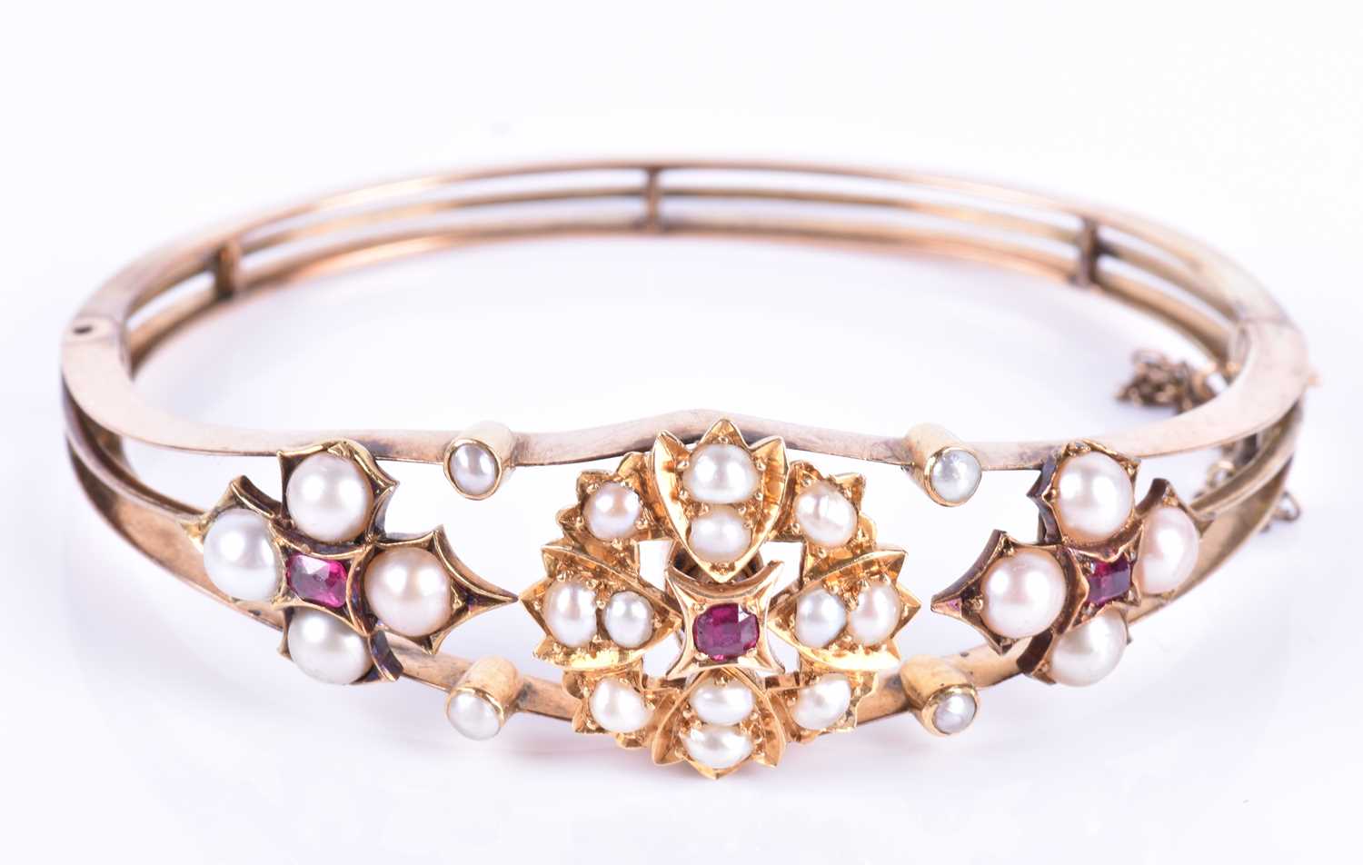 A Victorian 15ct yellow gold, pearl, and ruby banglethe hinged mount centred with a bright cut - Image 3 of 5