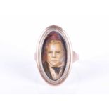 A 19th century rose metal mourning ringinset with an image of Sir Walter Scott, shank unmarked, size