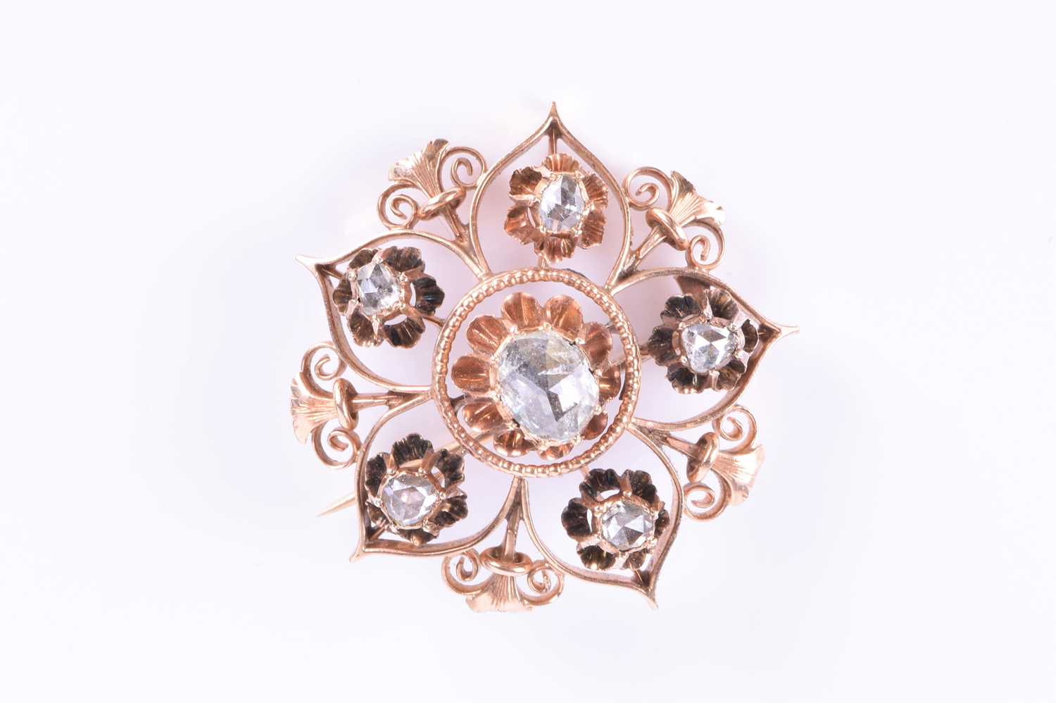 A rose gold and rose-cut diamond broochthe openwork floral mount centred with a mixed rose-cut