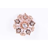 A rose gold and rose-cut diamond broochthe openwork floral mount centred with a mixed rose-cut