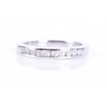 A white gold and diamond half eternity ringchannel-set with diamond accents of approximately 0.25