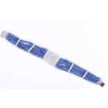 A sapphire and diamond bracelet four rows of graduated rounded sapphire beads interspersed with four