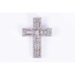 An 18ct white gold and diamond cross pendantset with calibre-cut mixed baguette diamonds, within a