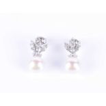A pair of diamond and pearl earringsthe fanned mounts set with three rows of graduated round