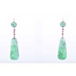 A pair of jade, ruby, and diamond drop pendant earringseach with a carved and pierced jade plaque,