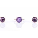 A 9ct yellow gold and amethyst ringset with a round-cut amethyst, approximately 10 mm diameter, size