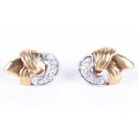 A pair of yellow gold and diamond earringsof knotted design, each inset with five round brilliant-