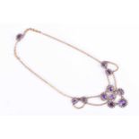 A late Victorian gold, amethyst, and pearl necklacethe chain suspended with mixed cushion and