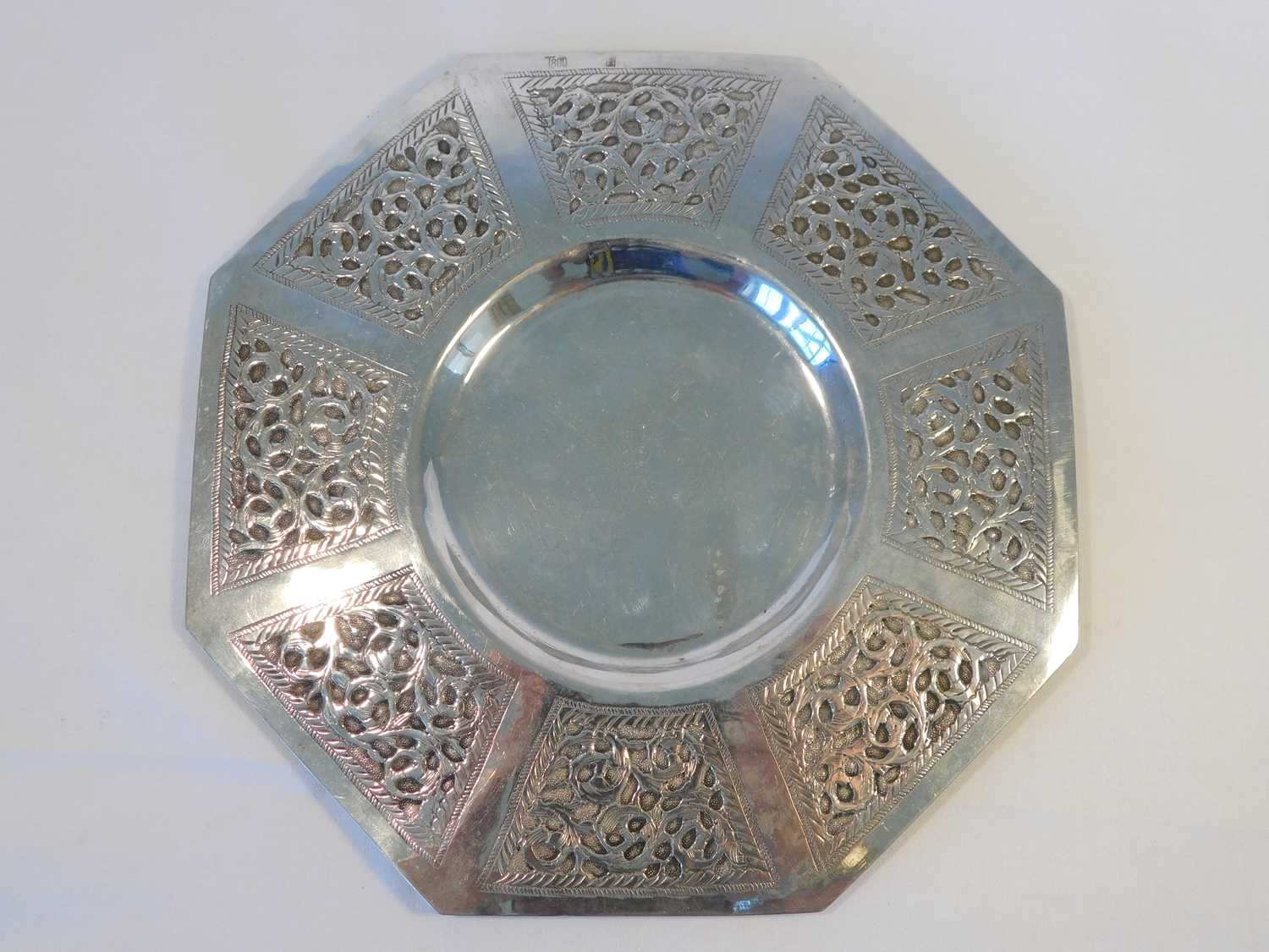 A Continental Arts & Crafts style silver dish, of octagonal form with recessed centre well framed by
