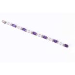 An amethyst and pearl braceletset with rectangular-cut amethysts alternated double rows of pearls,