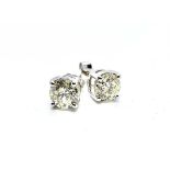 An 18ct white gold single stone diamond stud earrings, set with brilliant cut diamonds of K/L colour