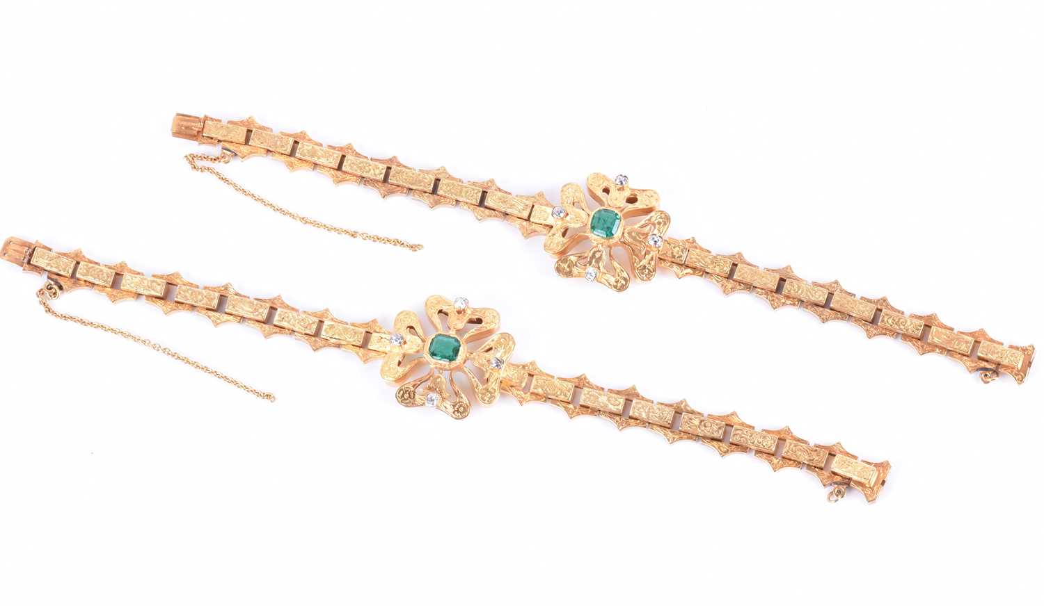 A fine pair of mid to late Victorian yellow gold, diamond, and emerald braceletseach with a