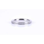 A platinum and diamond eternity ring, channel-set with round brilliant-cut diamonds of approximately