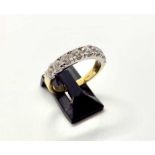 An 18ct yellow gold 8 stone diamond ring. 8 brilliant cut diamonds of H colour and SI clarity in