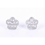 A pair of 18ct white gold and diamond floral cluster earrings each set with six open-backed rose-cut