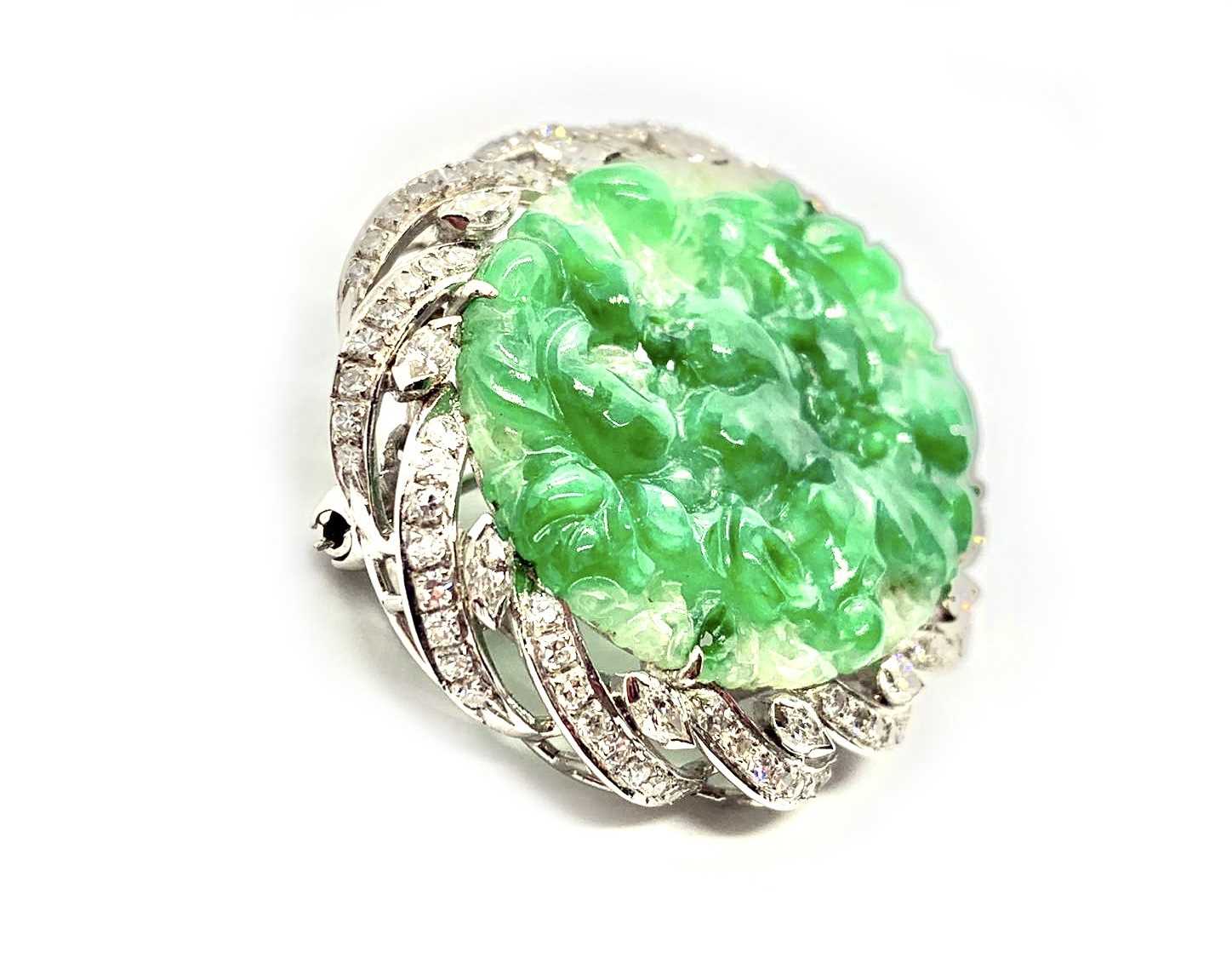 An 18ct white gold jade and diamond brooch, the central piece of carved jade surrounded by diamonds. - Image 4 of 4