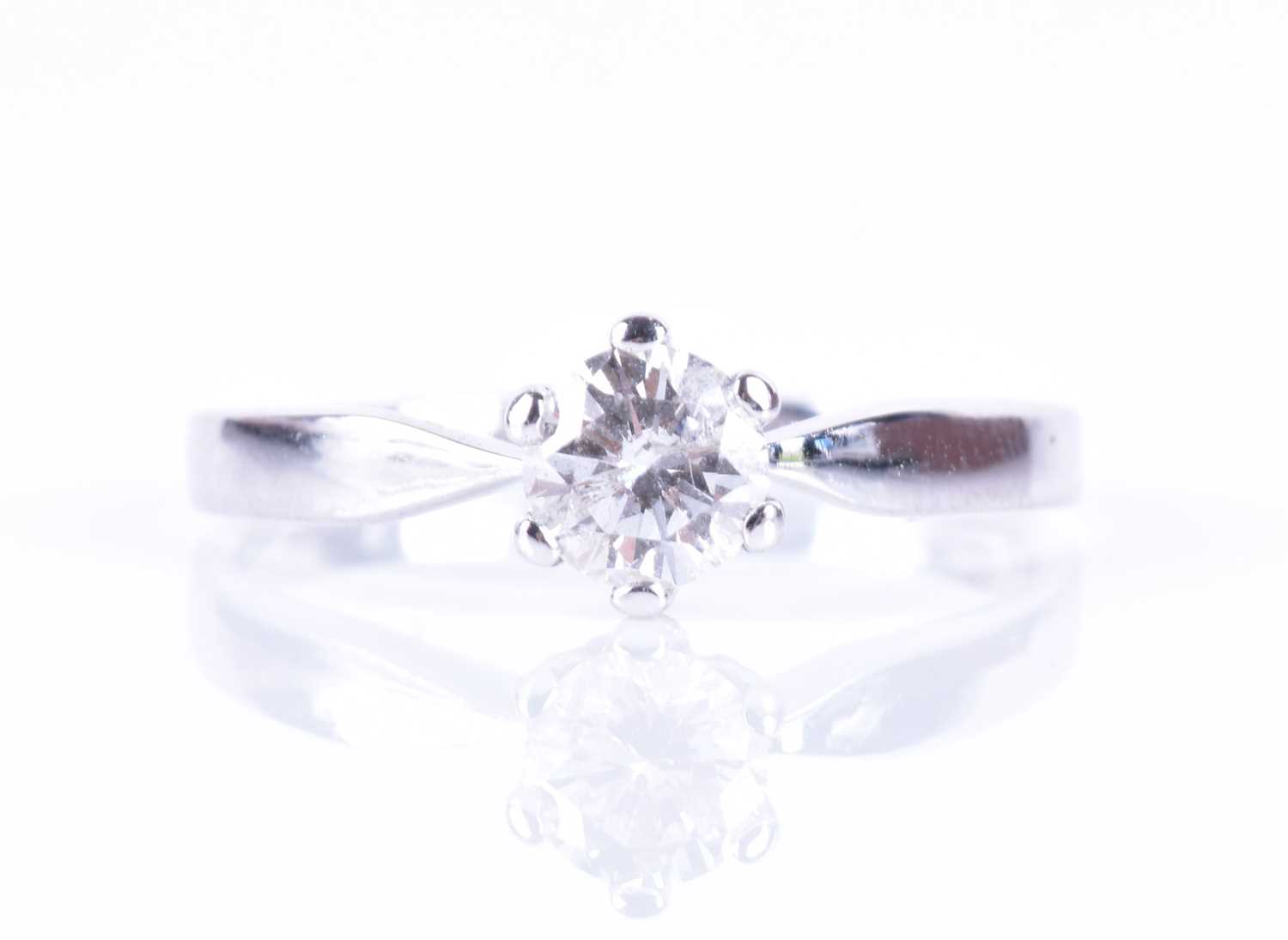 An 18ct white gold and solitaire diamond ringset with a round brilliant-cut diamond of approximately