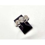 A platinum and diamond 3 stone ring. 3 old cut diamonds of J colour and Si clarity weighing a