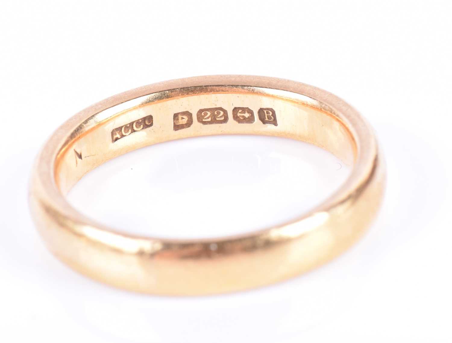 A 22ct yellow gold wedding bandsize L, together with an 18ct yellow gold and sterling silver - Image 3 of 3