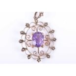 A Victorian 9ct yellow gold, amethyst, and split seed pearl pendantthe stylised openwork oval