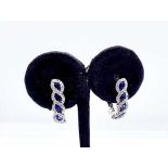 A pair of 18ct white gold sapphire and diamond small hoop earrings. 5 marquise cut sapphires of good