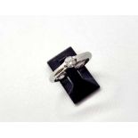 A platinum single stone diamond ring, the central claw set brilliant cut diamond of G colour and VS2