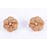 A pair of 18ct yellow gold and diamond earringsby Sterle of Paris, of floral design, each centred