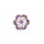 A late 1960s 9ct yellow gold, amethyst, and pearl cluster ringof floral design, size L, 4.9 grams.