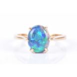 An 18ct yellow gold and opal ringset with an oval cabochon opal, measuring approximately 8 x 10