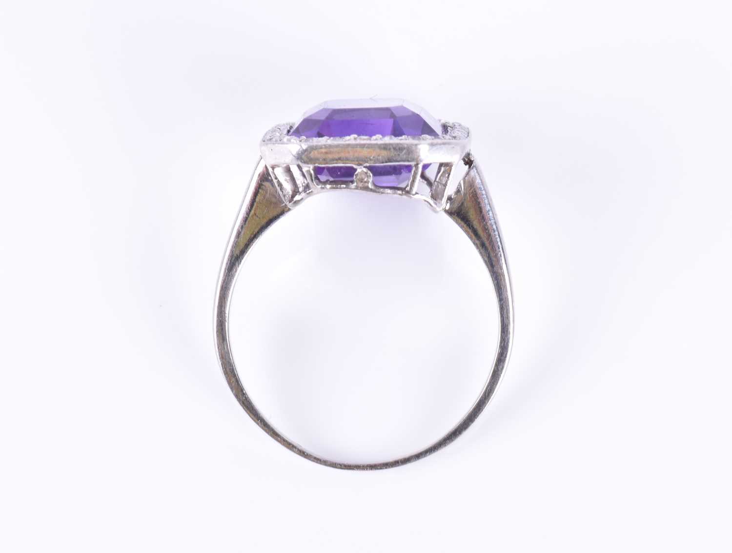 A diamond and amethyst cocktail ringin the Art Deco style, set with an emerald-cut amethyst within - Image 7 of 7