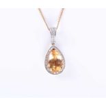 An 18ct gold, diamond, and citrine pendantset with a mixed pear-cut citrine of approximately 4.0