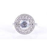An 18ct white gold, diamond, and aquamarine halo cluster ringcentred with a mixed round-cut