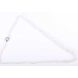 A natural pearl necklaceof graduated pearls, largest approximately 6.5 mm, smallest 2.5 mm, fastened