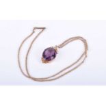 A Victorian yellow gold and amethyst glass pendantthe mixed oval-cut amethyst mounted to base and