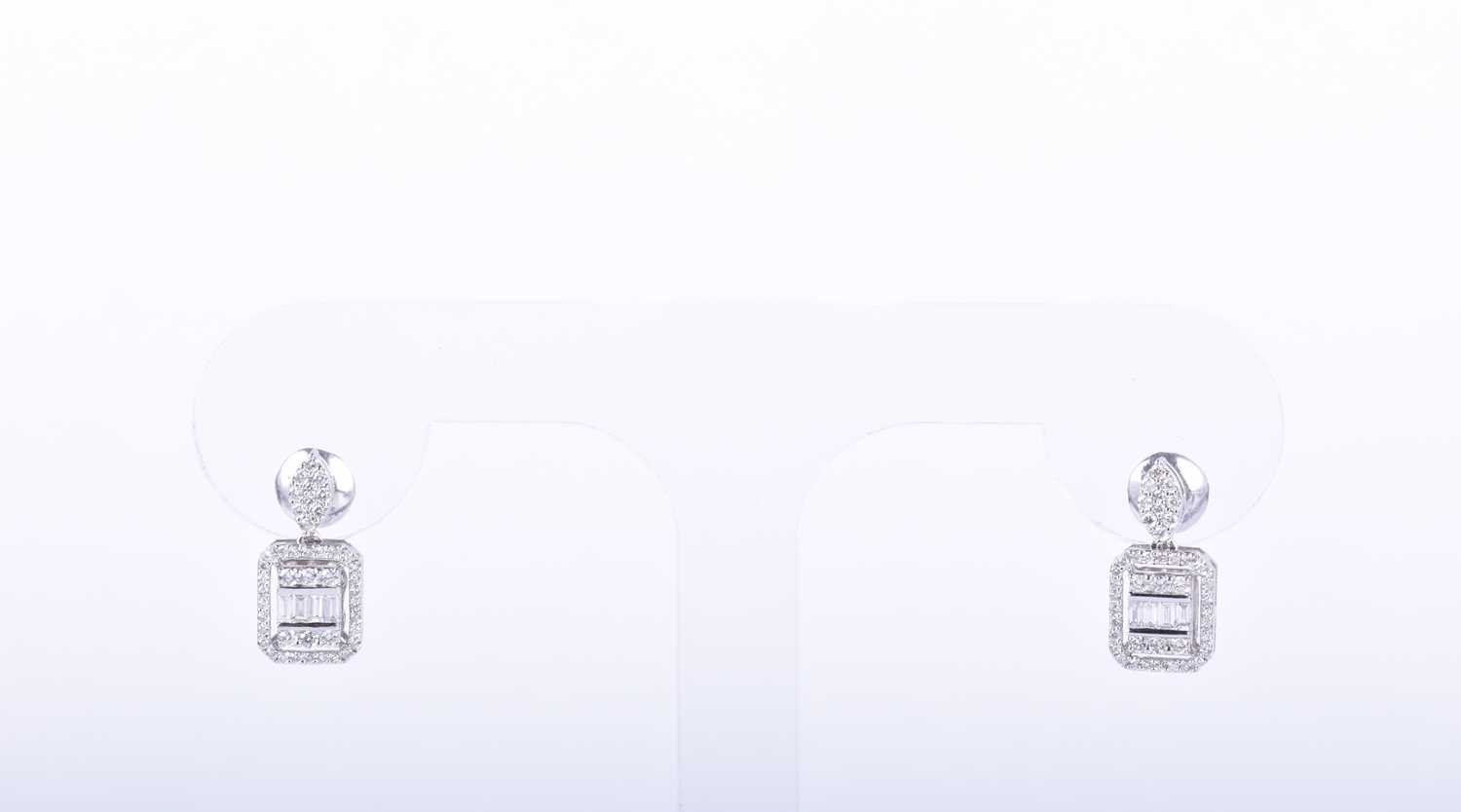A pair of diamond cluster earringsthe chamfered rectangular mounts inset with round and baguette-cut